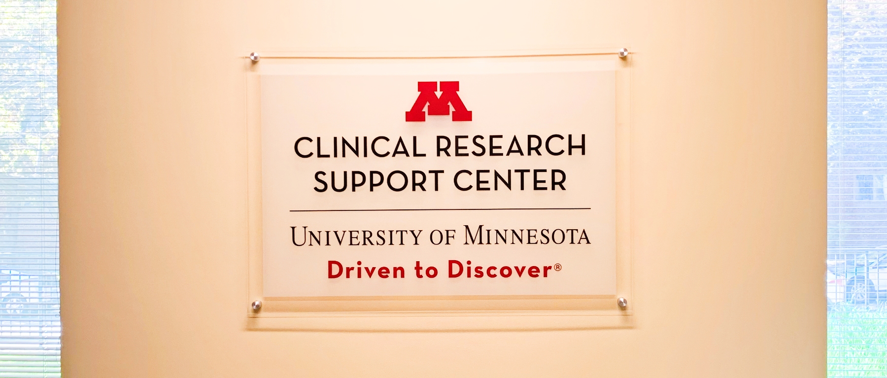 Sign that says "Clinical Research Support Center - University of Minnesota - Driven to Discover"