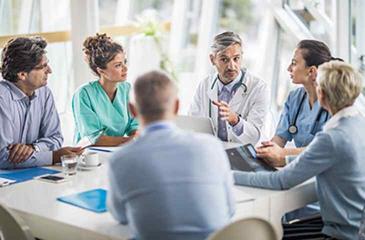 Healthcare professionals sitting at a table
